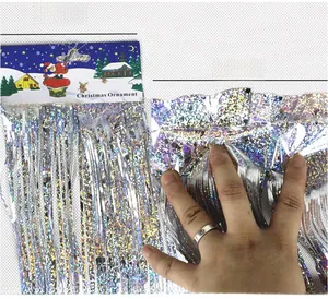 Detail of silver laser tinsel curtain showing 10cm and 15cm width options for party decor