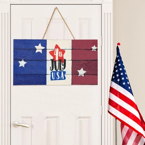 Rustic 4th of July USA wooden welcome sign hanging on white door for Independence Day