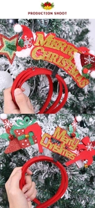 Detail of Christmas headband with golden Merry Christmas text and festive red star decor