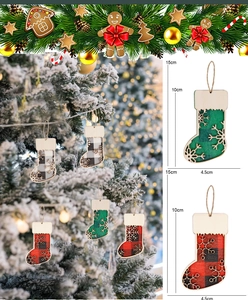Detail of wooden Christmas stocking ornaments with plaid patterns and snowflake cutouts