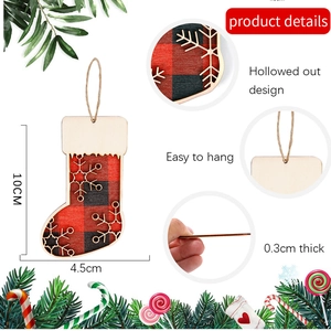 Detail view of 10cm wooden Christmas stocking pendant with buffalo plaid and snowflake cutout