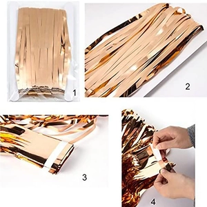 Rose gold metallic foil fringe curtain for party backdrops with adhesive backing strip