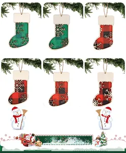 Close-up of wooden Christmas stocking ornaments with buffalo plaid and snowflake patterns