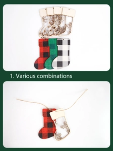 Detail of wooden Christmas stocking pendants with hollow snowflake patterns and plaid textures