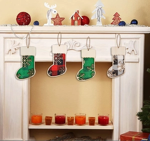 Set of 4 rustic wooden Christmas stocking ornaments with plaid patterns and snowflakes