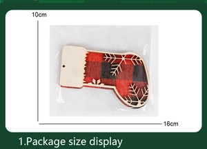 Wooden Christmas stocking ornament with buffalo plaid and snowflake cutout in packaging