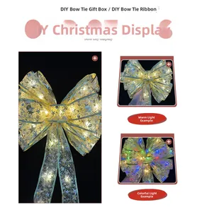 Close-up of golden organza LED Christmas bow with glowing warm lights and star patterns