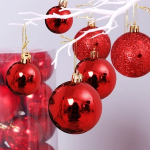 Set of shiny and glittery red Christmas balls with gold strings for holiday decorations