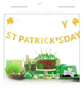 Glittery Happy St. Patrick's Day banner hanging above festive party decorations and props