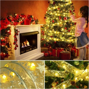 Golden LED Christmas ribbon string lights with silver stars for festive tree decoration