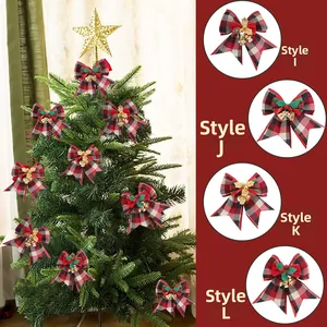 Detail of Christmas bows with red plaid pattern, golden bells and festive pine berry decor