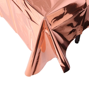 Close-up detail of rose gold PET disposable tablecloth with metallic glossy finish
