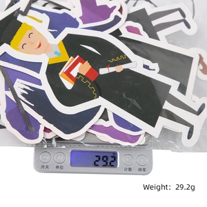 Detail shot of graduation party banner set with cartoon student cards on scales