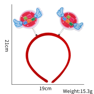 Detail view of a red headband with wings and text for kindergarten performance events