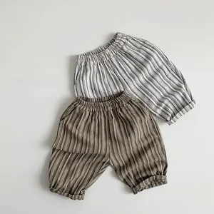 Detail view of cotton linen striped kids shorts with elastic waist and side pockets
