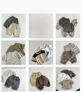 Detailed grid of minimalist kids cotton outfits in earth tones including shorts and tees