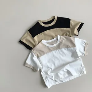 Detailed view of color-block kids cotton t-shirts in khaki with black and white accents
