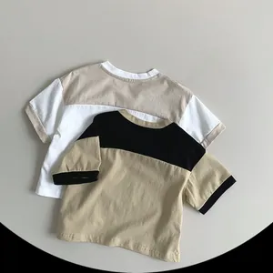 Detailed flat lay of two-tone cotton kids' short-sleeve T-shirts with ribbed crew neck