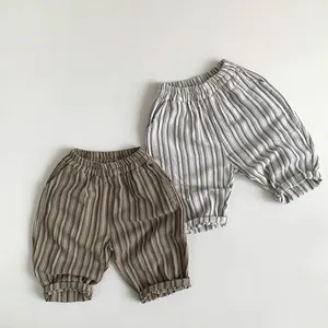 Detail of children's striped shorts showing elastic waistband and fabric texture