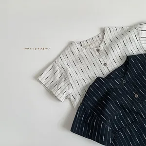 Detailed close-up of textured cotton linen striped short sleeve shirts for kids