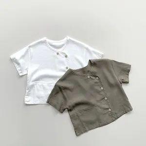 Detailed flat lay of children's cotton linen shirts with buttons and pocket detail