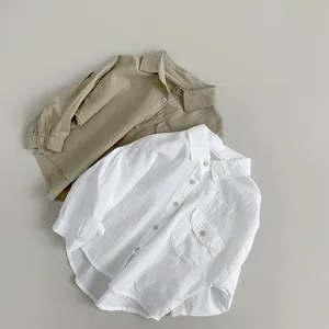Close-up of soft crinkle cotton texture and chest pocket on kids button-down shirts