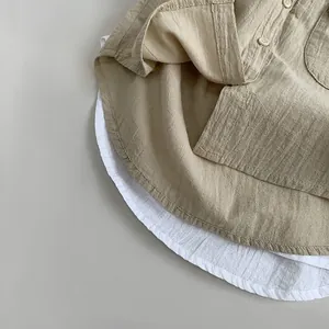 Soft cotton linen kids button-up shirt with layered hem and pocket detail in khaki