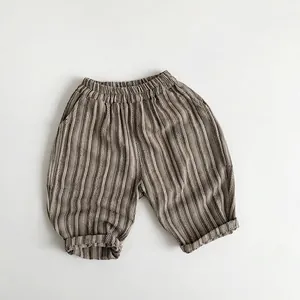 Detailed flat lay of striped cotton-linen kids pants with elastic waist and rolled cuffs