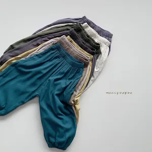 Detailed pile of kids anti-mosquito loose joggers in various colors with elastic cuffs