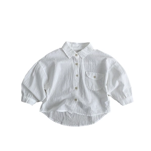 Children's white long-sleeve cotton shirt with wooden buttons and curved hem