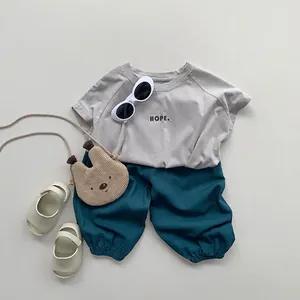 Kids smooth summer set with gray HOPE t-shirt and dark teal anti-mosquito loose pants