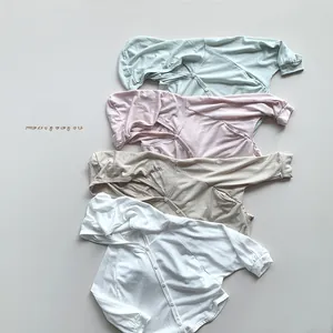 Detailed macro view of soft cotton kids sun protection hoodies in four pastel colors