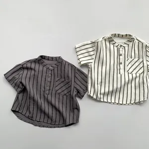 Detailed macro view of charcoal and cream striped cotton shirts with textured fabric