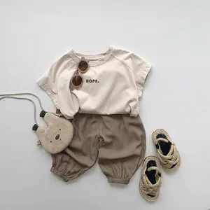 Toddler summer set featuring a beige HOPE T-shirt and loose brown anti-mosquito pants