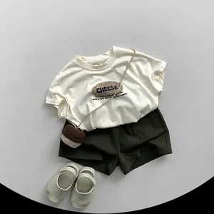 Kids summer cotton outfit featuring cream CHEESE print T-shirt and dark green casual shorts
