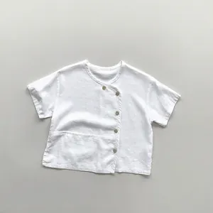 Close-up of kids white linen T-shirt featuring a unique side button placket and wood buttons