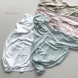 Detail view of lightweight hooded sun protection shirts in white, green, pink, and beige