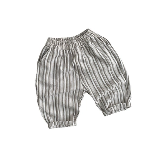 Kids vertical striped cotton harem pants with elastic waist and side pockets in beige and white