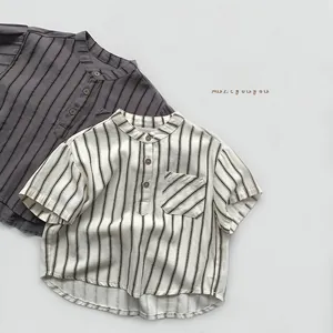 Detailed view of kids vertical striped shirts in cotton linen with buttoned mandarin collar