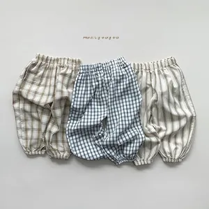 Detailed view of kids breathable cotton plaid pants with elastic waist and cuffs