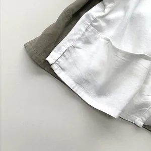 Kids linen cotton short sleeve T-shirt showing natural fabric texture and side split