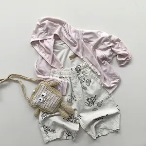 Lightweight summer sun protection hoodie set with floral shorts and a small knit bag