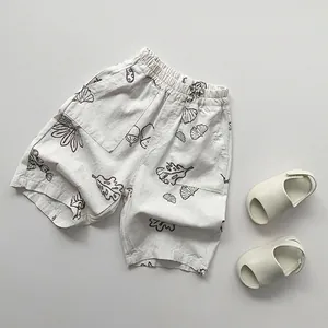 Close-up of children's cotton linen printed pants with elastic waist and botanical pattern