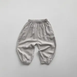 Detail of light gray kids mosquito pants showing elastic waistband and gathered cuffs