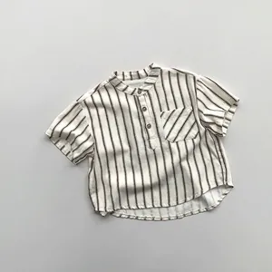 Detailed view of striped cotton shirt featuring wooden buttons and a front pocket