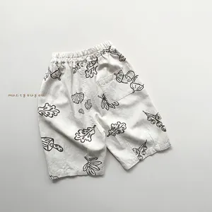 Detailed view of kids cotton linen shorts with botanical prints and elastic waistband