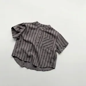 Detail of grey striped kids short sleeve shirt with stand collar and chest pocket