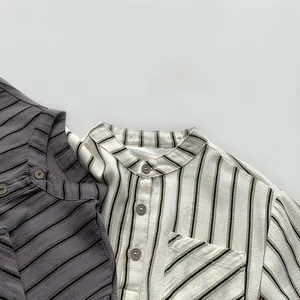 Detailed macro view of cotton linen striped shirts with stand collar and pocket