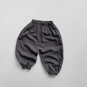 Close-up of elastic waistband and soft dark grey fabric on children mosquito pants
