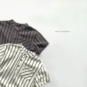 Detail of short-sleeve striped kids shirts with Henley collars and small chest pockets